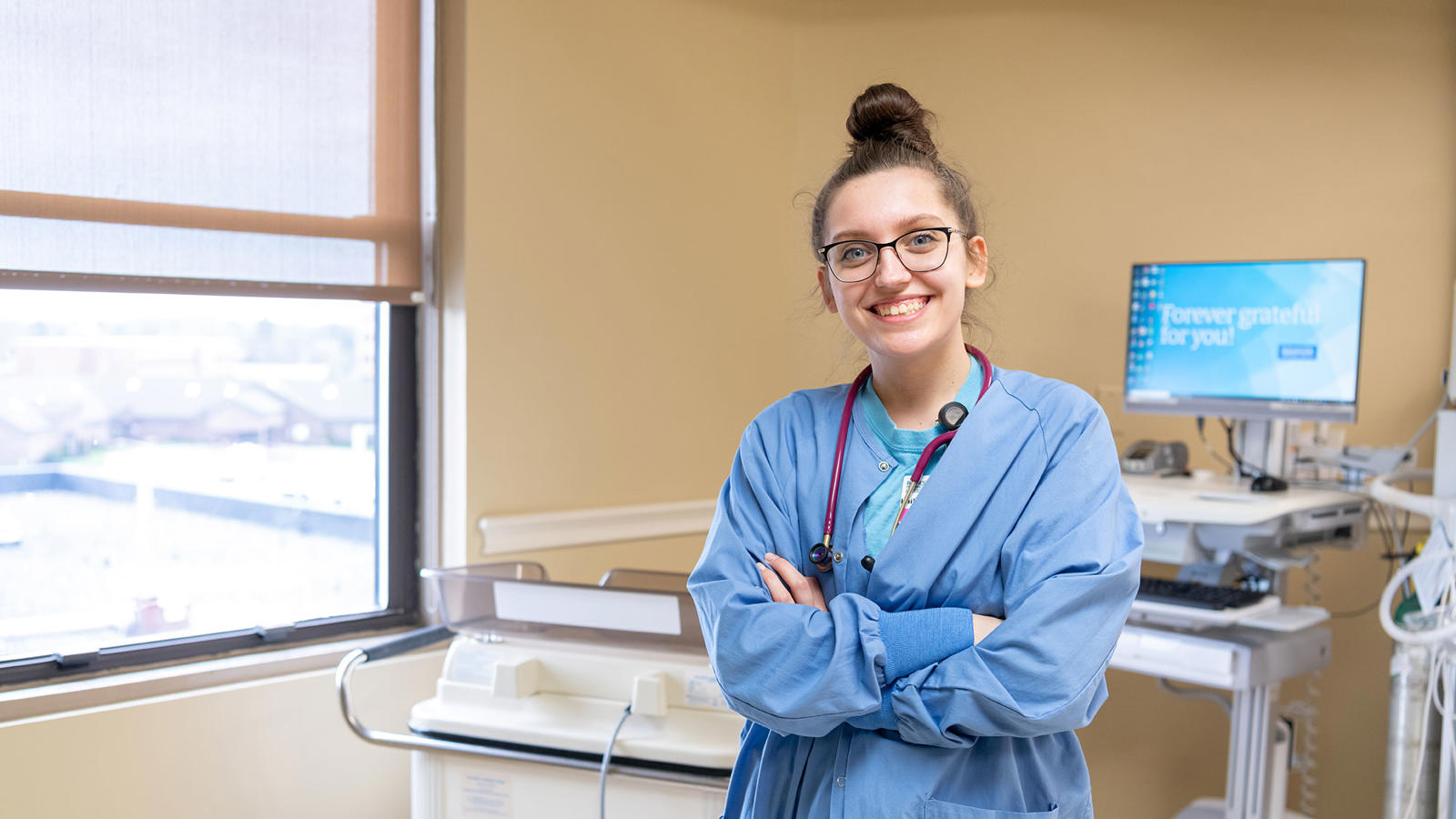 a woman in a blue scrubs